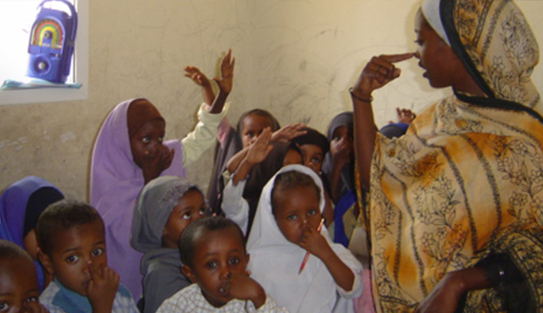 Teacher and students with an Interactive Radio learning session