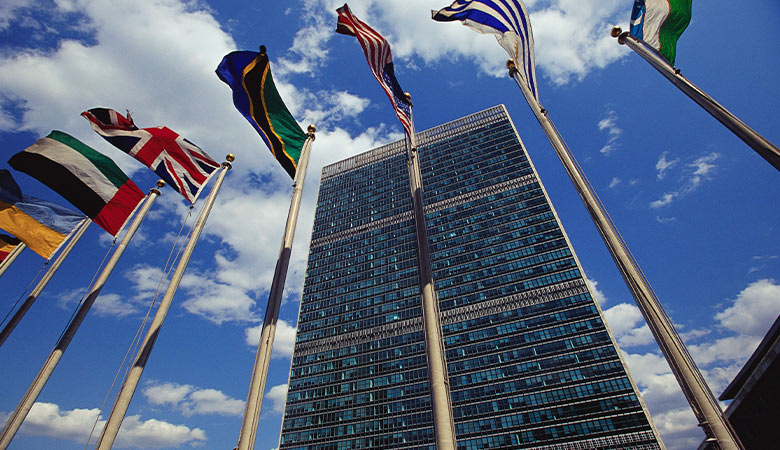 Photo of flag rows in front of the UN building