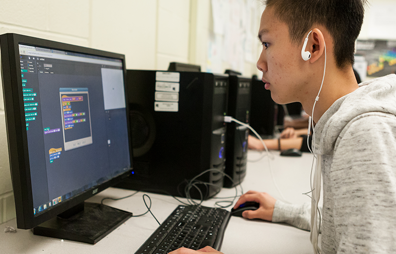 A photo of a student using a computer representing How Can We Support Computational Thinking in Schools?