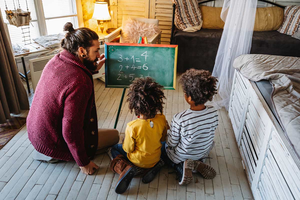 A parent doing math with young children