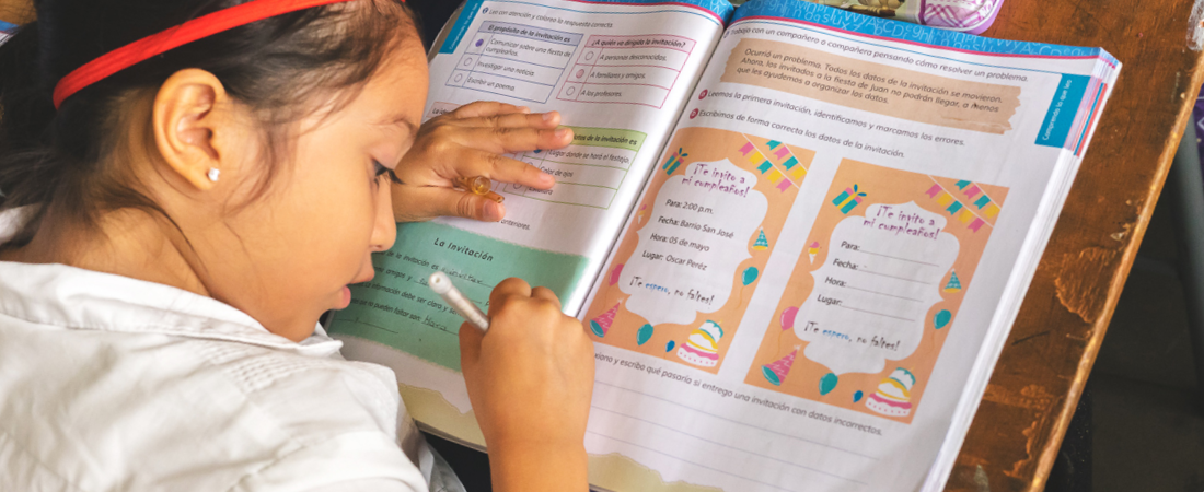 A Honduran student working on Spanish homework, to depict 