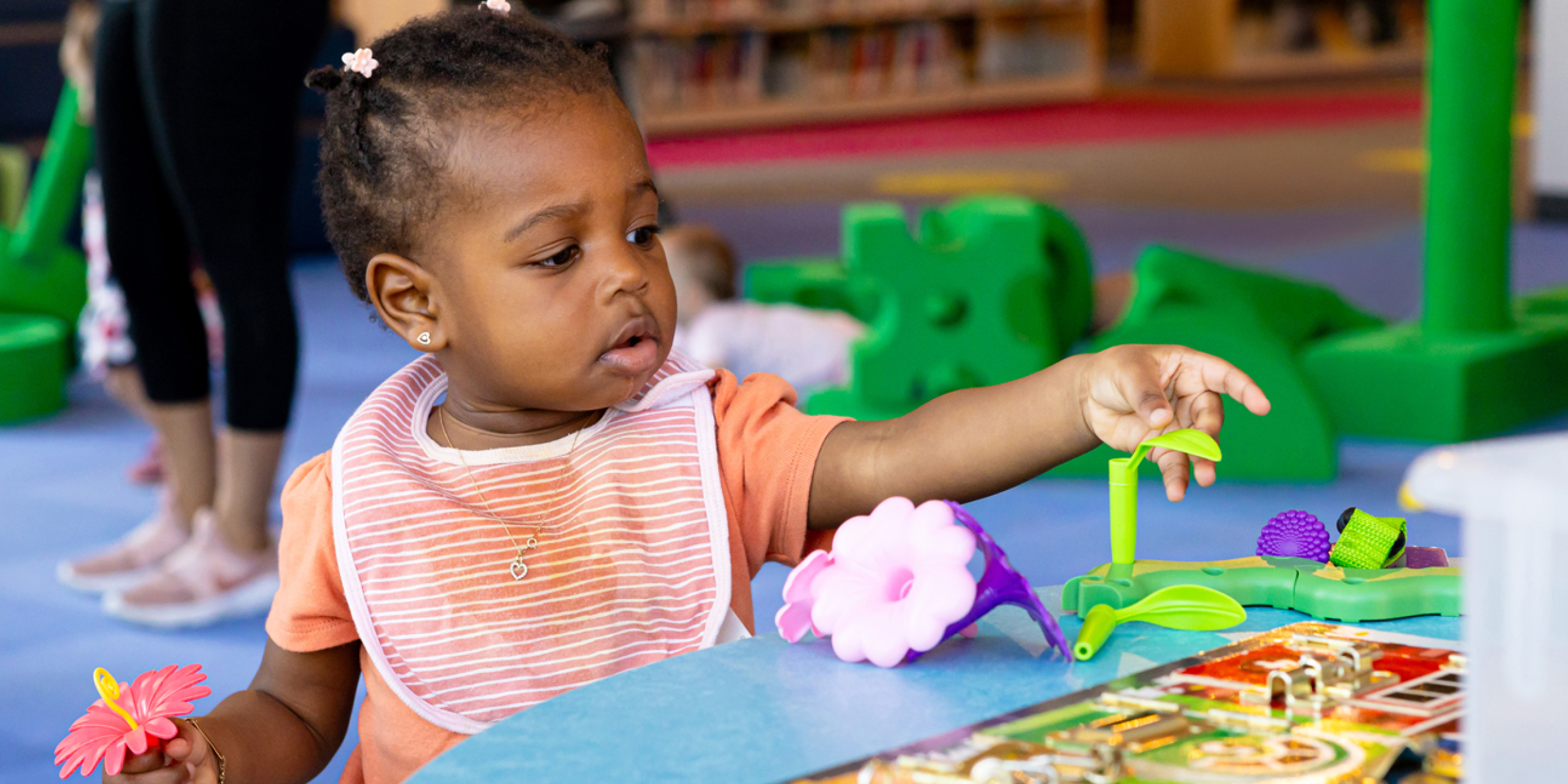 A photo of a child engaged in a STEM activity representing Part 2—The Scientist at Your Library: It May Not Be Who You Think