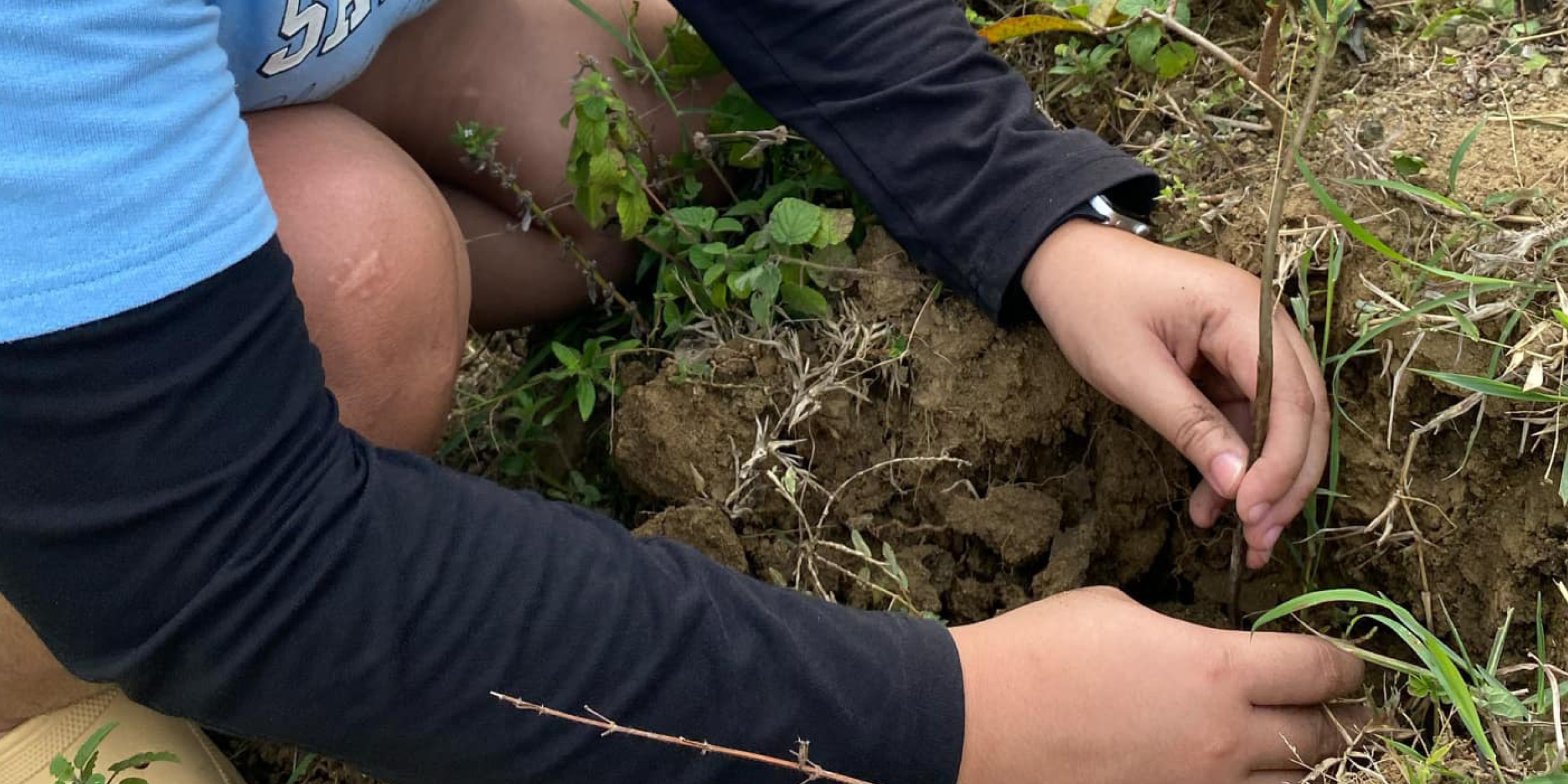 A photo of a youth participating in R&E project representing From Seedling to System Change: How Indigenous Youth Are Using Tech to Protect Ancestral Lands
