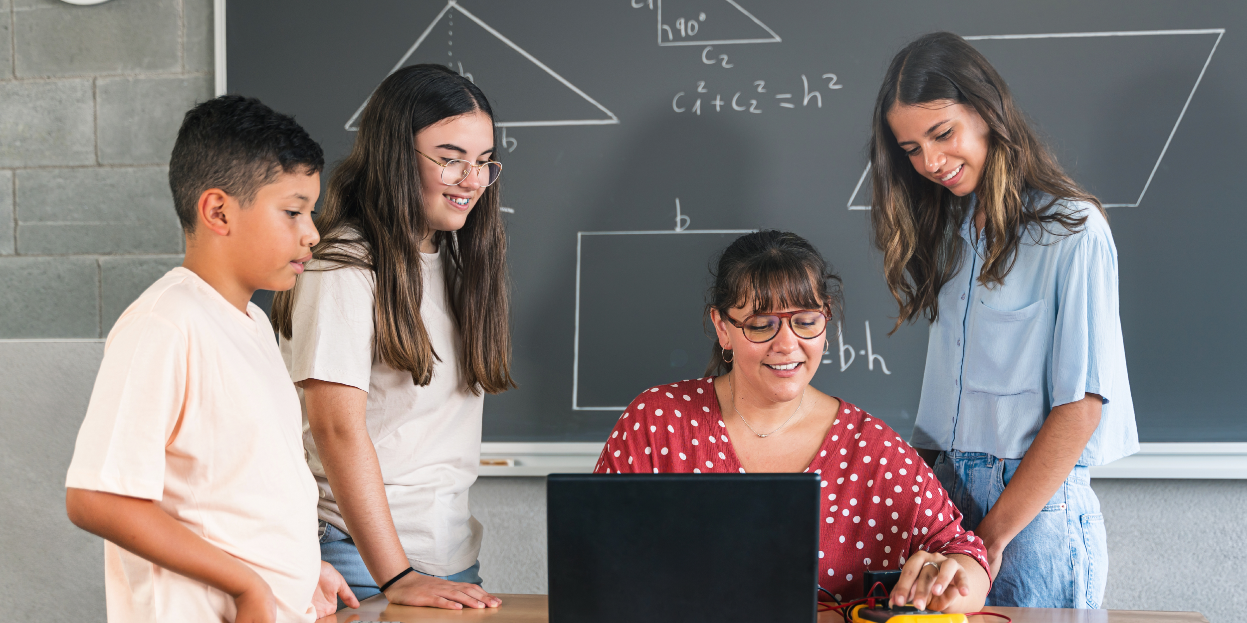 A photo of a teacher and students representing Putting an MTSS Lens on Mathematics