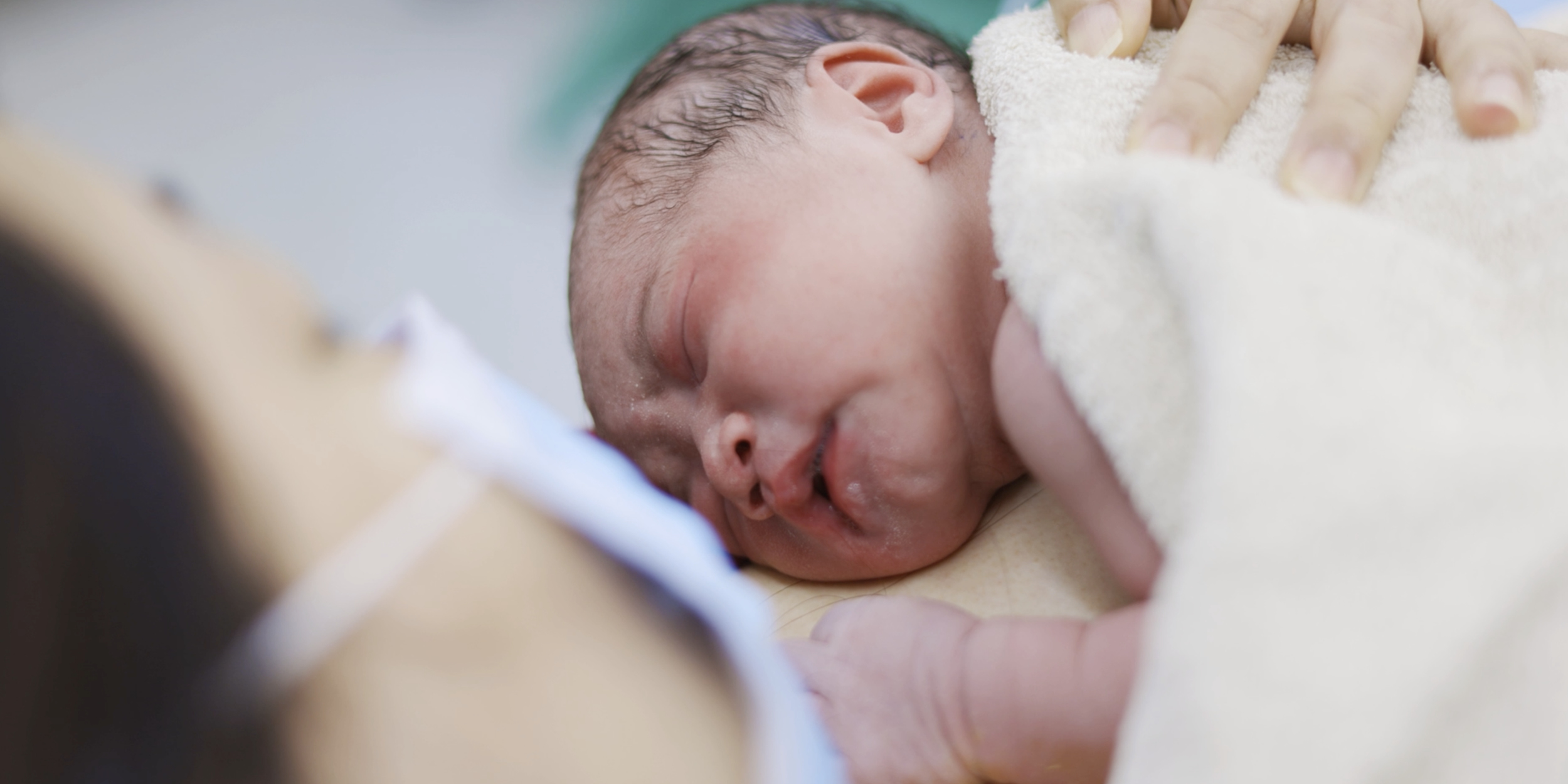 A photo of a baby representing EDC Partners with DPH on New Massachusetts Maternal Health Initiative