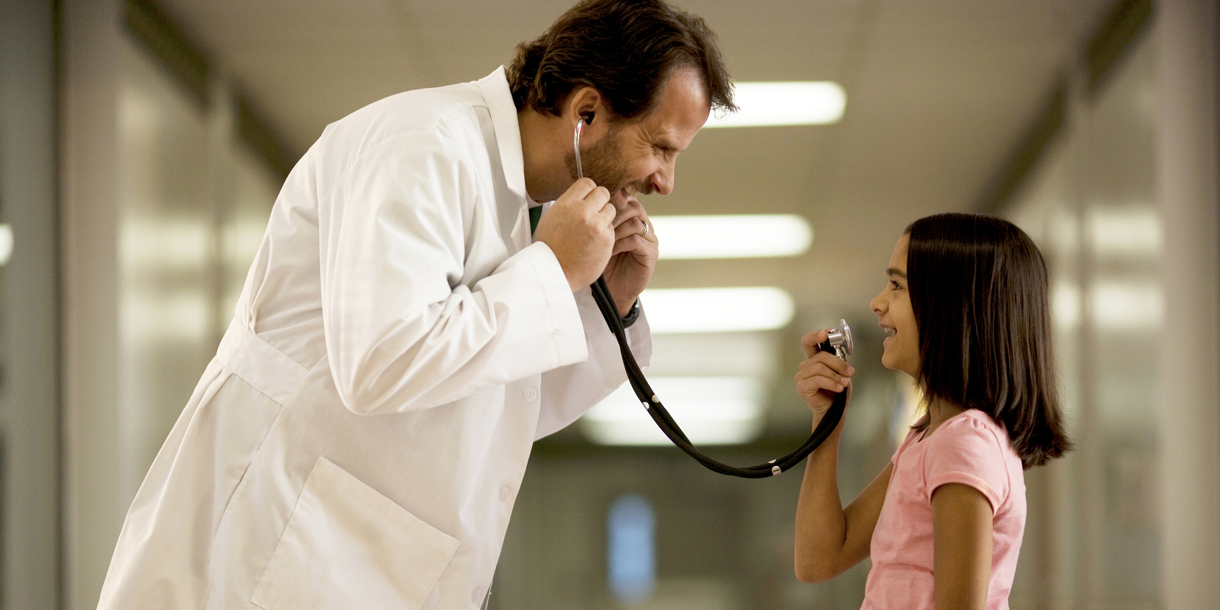 A photo of a doctor and youth representing EDC to Lead Project on Integrating Computer Science into Elementary Math